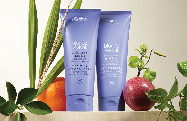 Product imagery of blonde revival™ purple toning shampoo and conditioner.
