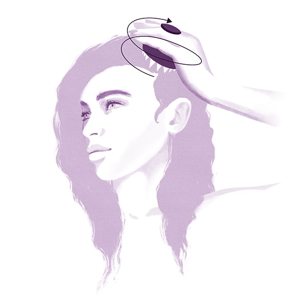 Step 2: Using the invati advanced scalp massager, work in circular motions from the hair line to the crown of the head. 