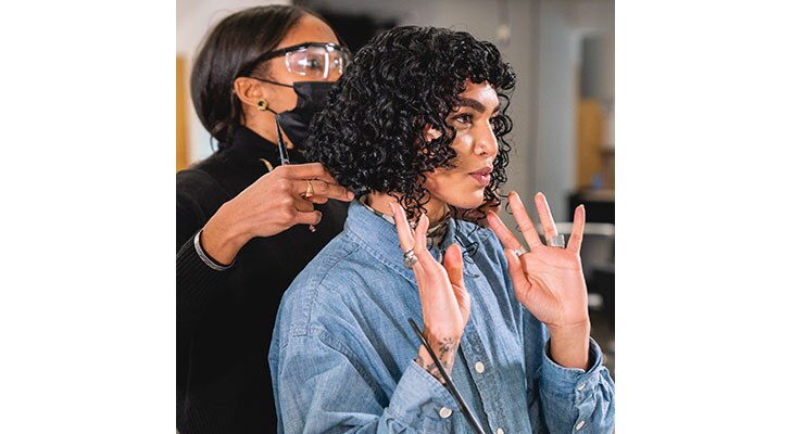 Sophia Roe getting a hair cut from Global Artistic Director of Texture, Renée Gadar